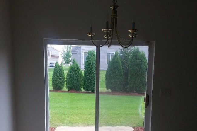 Dining room with glass Patio doors - 6427 Blue Sky Ln