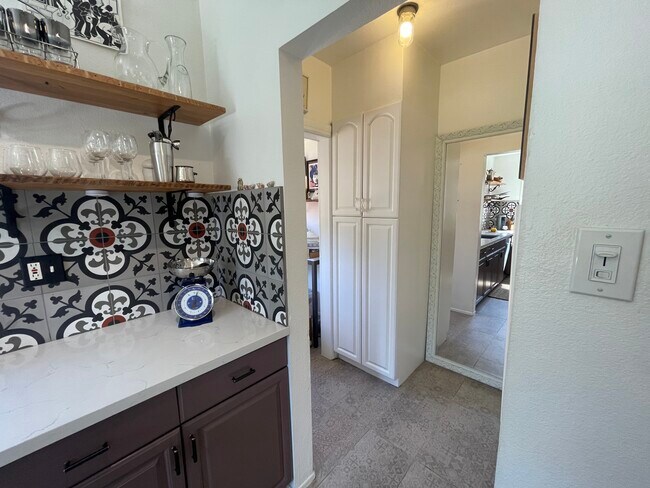 Hallway off the kitchen leading to laundry nook, bathroom, and patio - 1501 Westerly Ter
