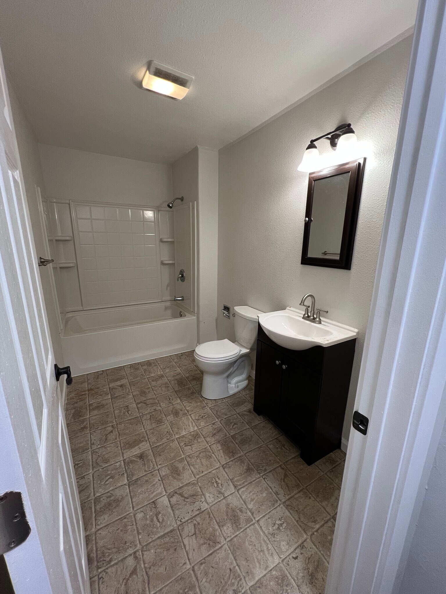 Newer vanity, medicine cabinet and lights. - 620 6th Ave