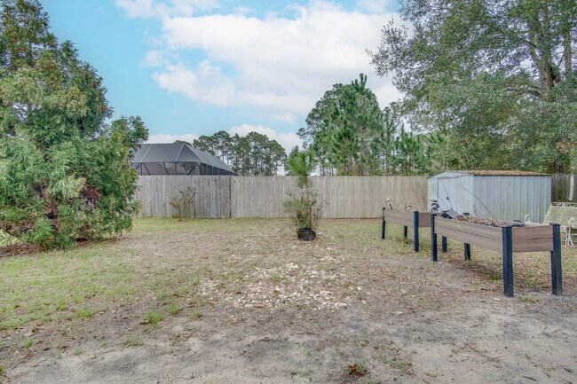 Building Photo - Updated 4BR/3BA Brick Home Near NAS Pensacola with Office & Screened Porch