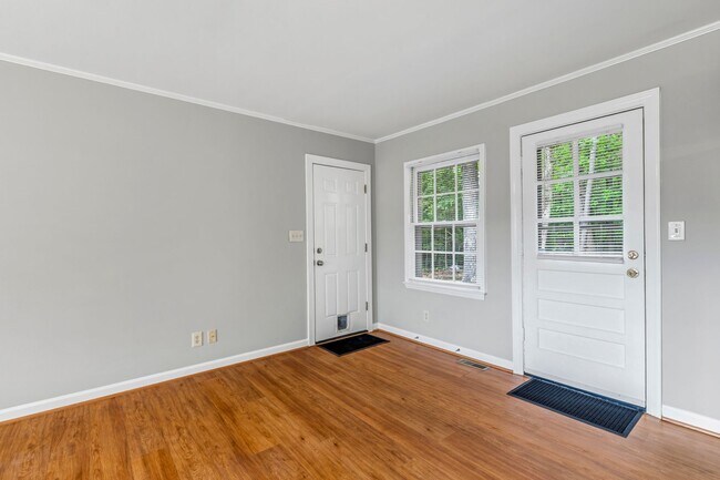 Building Photo - Updated Home, Stainless Steel Appliances, Wood Like Flooring, Deck, Garage!