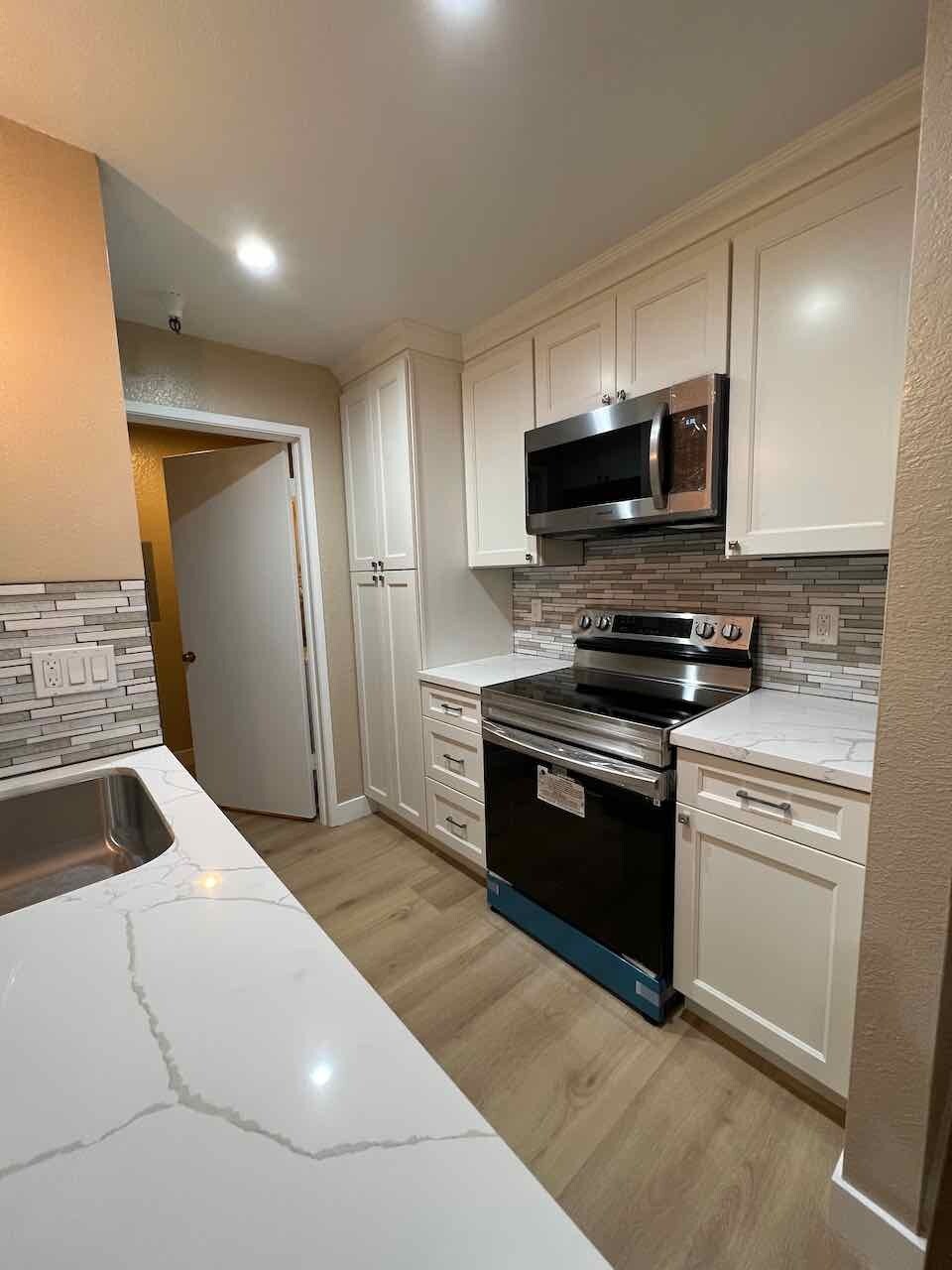 White cabinets with soft close doors and drawers - 3183 Wayside Plz