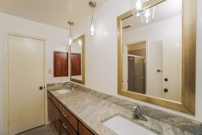 Building Photo - Charming 2-Bedroom Condo in Gated Community Surrounded by Mature Trees