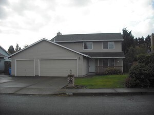 Primary Photo - Huge deck, triple car garage/RV parking, storage