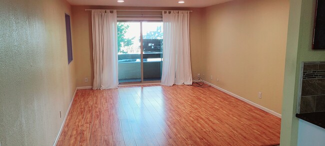 Spacious living area opens to patio. - 466 Crescent St