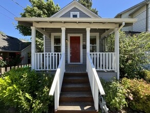 Building Photo - Charming Cottage with Hardwood Flooring, Modern Kitchen & Beautiful Outdoor Living Areas