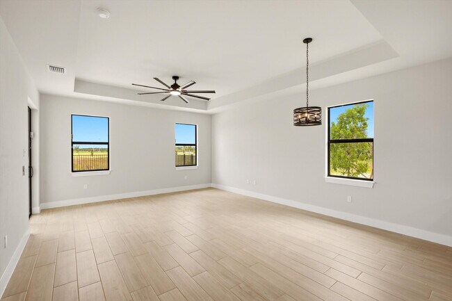 Building Photo - New Construction 3/2 Pool Home on Canal, $2,699, NW Cape Coral. The Only Thing Used Here Is the W...