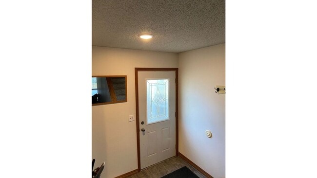 Building Photo - Spacious 3 - Bedroom Townhome with Modern Updates & Private Green Space.