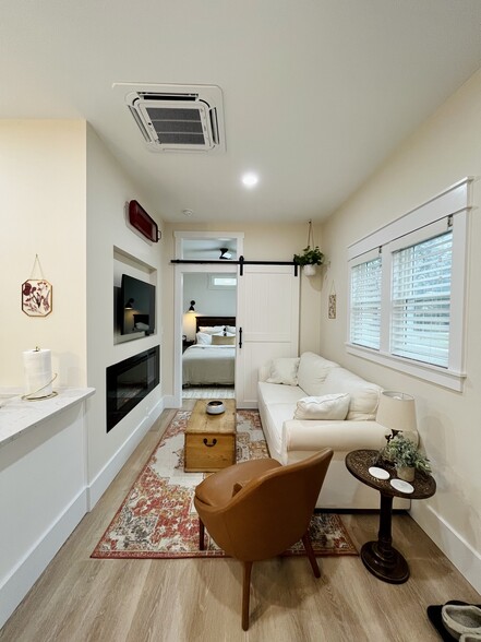 Living room with electric fireplace and swivel mount TV - 853 W 8th St