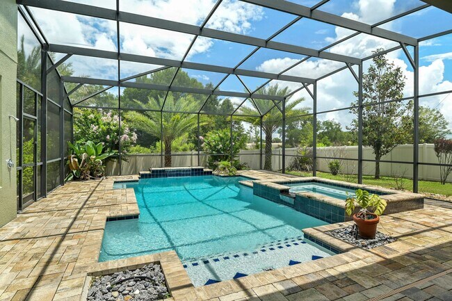 Building Photo - Expansive 4 bedroom, 3 bath remodeled home in gated community