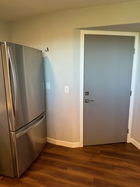 Secondary entrance door leads to shared interior hallway and stairs. - 7079 Engineers Rd