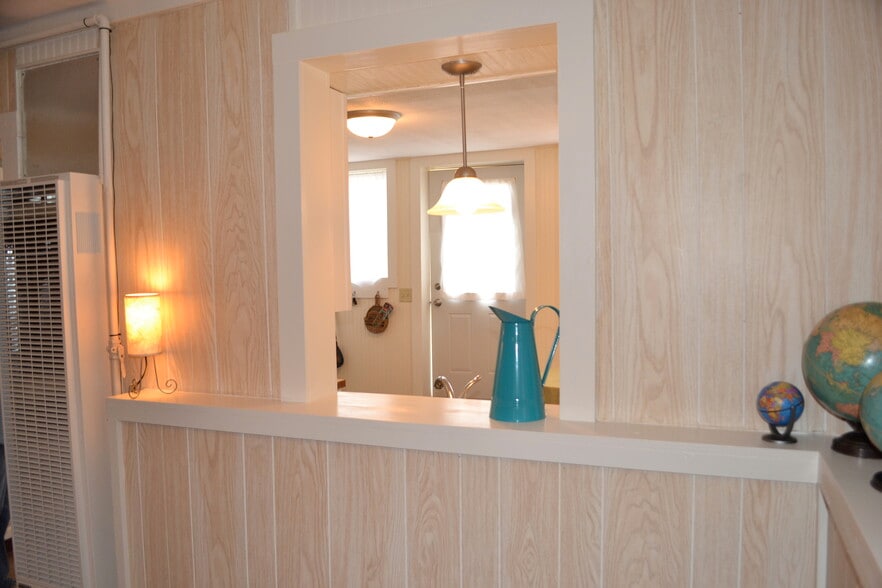 looking into kitchen at pass-thru over sink - 222 W Case St