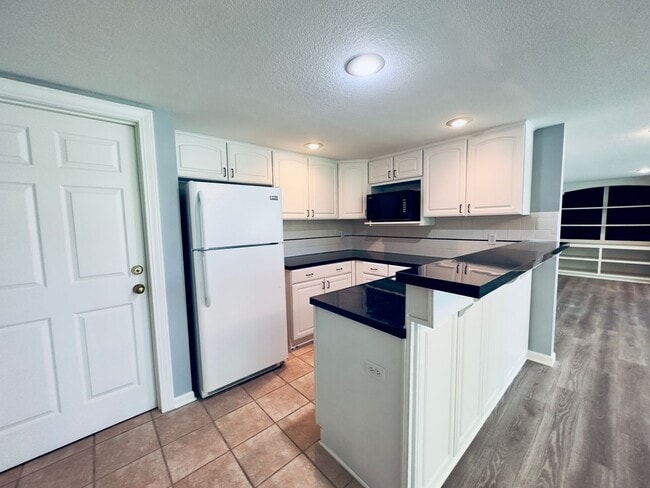 Building Photo - {6411} Enchanted Lake Estates + Updated Kitchen, Fresh Paint Throughout +  Main Floor Primary Bed...