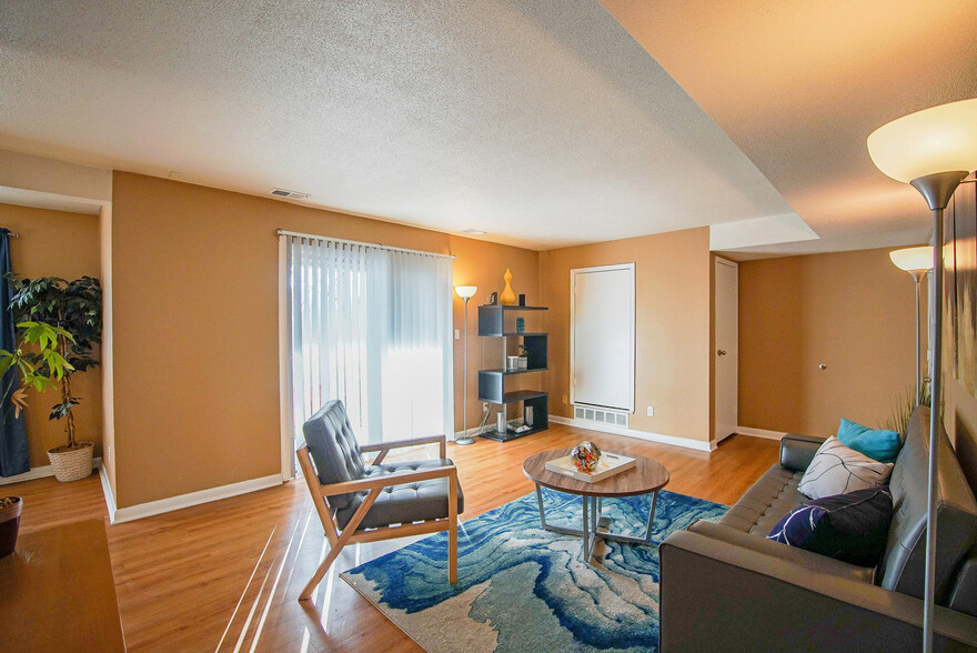 Living Room & Private Balcony - Colonie Apartments