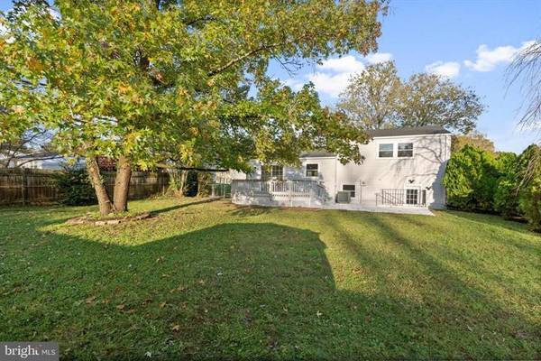 View of the house from the back of the fully-fenced yard. - 7922 Fitzroy St