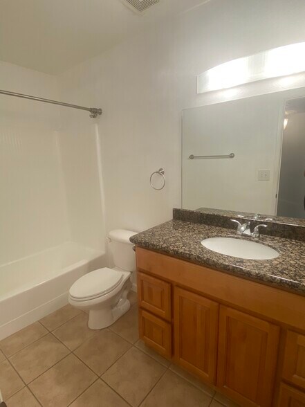 Full sized bathroom with coordinating countertops - 5877 N Granite Reef Rd
