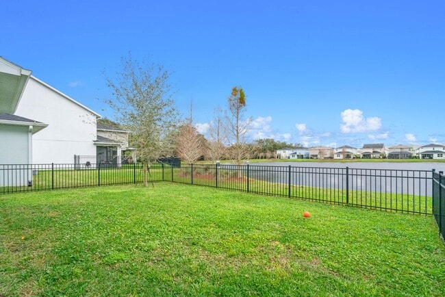 Building Photo - Water Front Home- 4 Large Bedrooms-3 baths Gated Community Call Sheila Campbell 407-687-7900