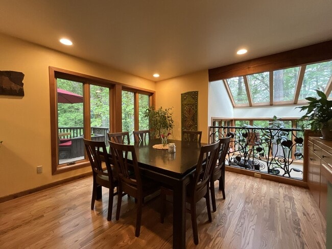 Building Photo - One-of-a-Kind Custom Home with Wall of Windows, Stone Fireplaces, Expansive Entertainment Space &...