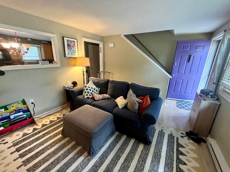 Living room with updated flooring - 98 Hayward St