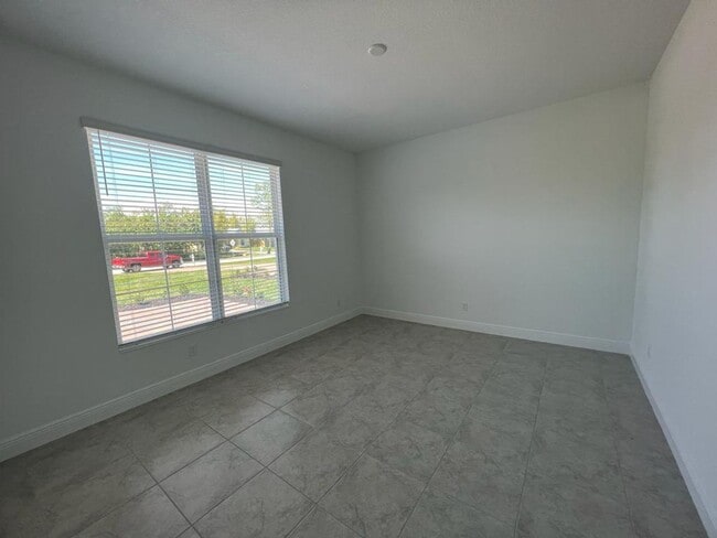 Building Photo - This Charming Brand-New Home is a 4/3 with...