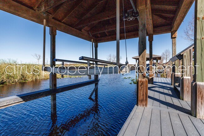 Building Photo - Stunning Double Waterfront 4/3 Home with Dock and Electric Boat Lift
