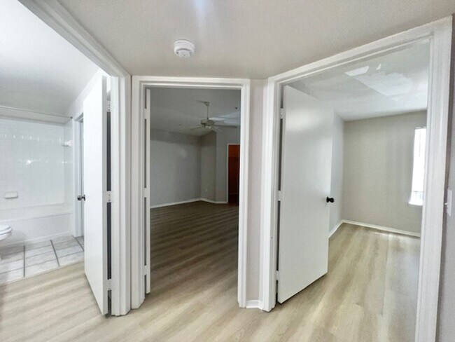 Building Photo - NEW-Remodeled bathroom & kitchen! NEW VINYL PLANK flooring & fresh paint! 2 bedroom 1 bath condo ...