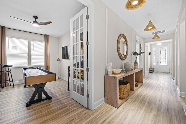 Building Photo - "Luxurious Furnished Home with 4-Bed, 3-Bath, Swim Spa Fenced Yard Golf Cart steps to the beach!"