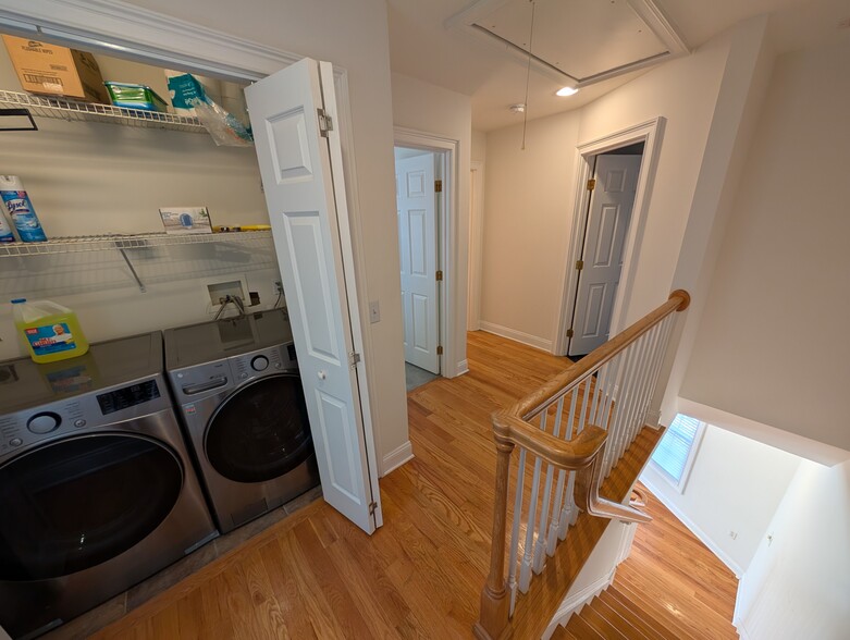 Laundry units, entries to additional guest bedroom and guest full bathbath - 100 Castle Ave