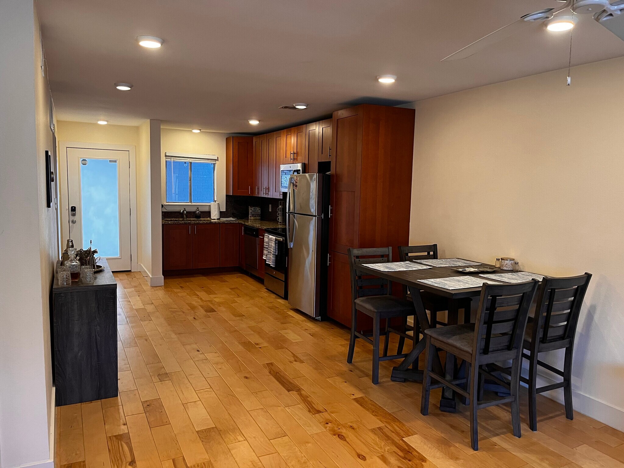 The open-concept kitchen gives a roomy feel as it blends with the living room space. - 909 Reinli St