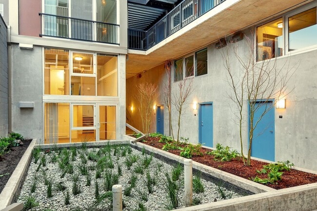 Building Photo - Stylish Urban Living with Sustainable Comf...