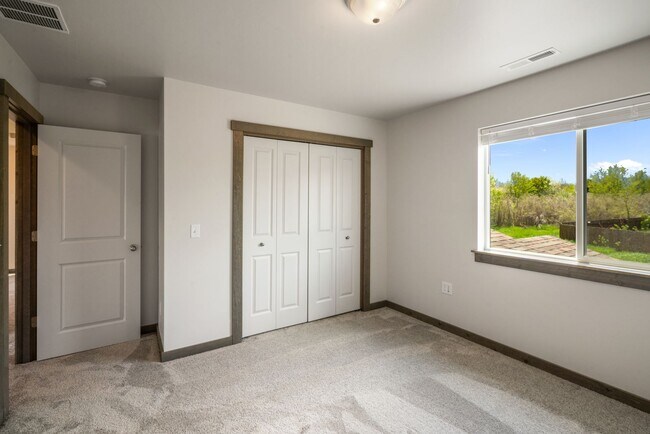 Building Photo - Pet Friendly! Gorgeous 3 Bedroom condo with double stall attached garages with AC.