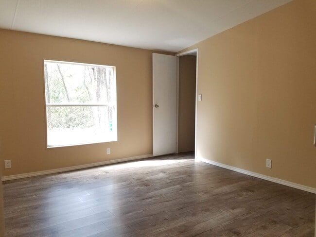 Building Photo - 3 bedroom 2 bath on 1/2 acre of land with a FENCED YARD
