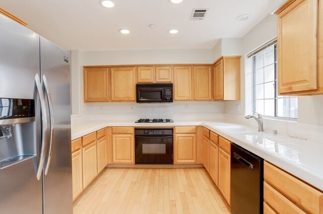 Building Photo - 3 Bed / 2.5 bath, three-level townhome with a bonus home office/den + EV charger in garage. YouTu...