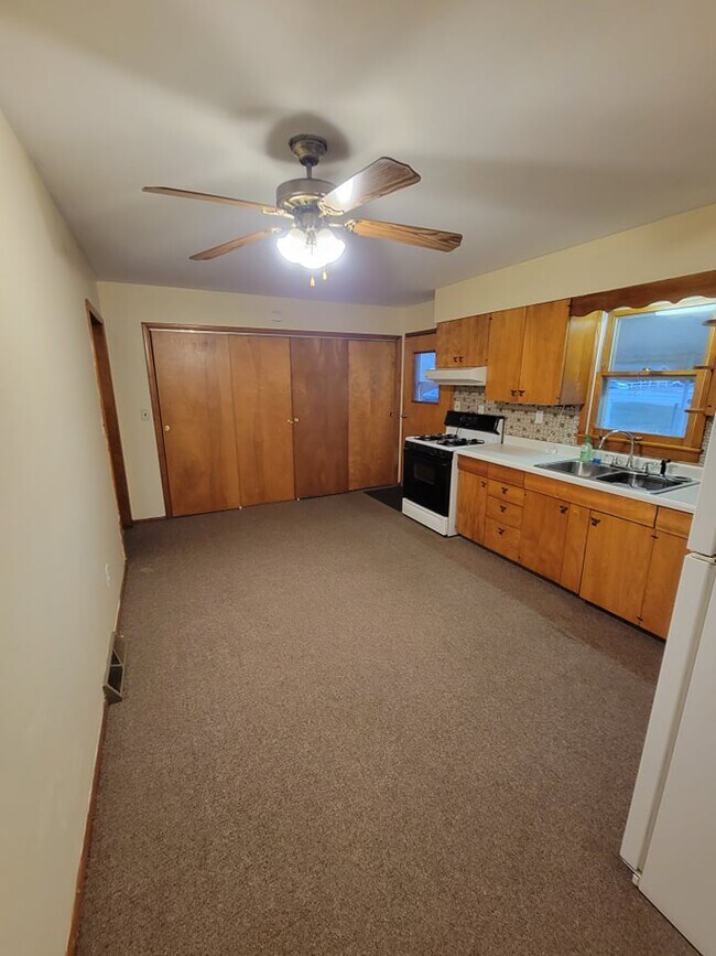 Kitchen view of laundry area - 104 S Park St