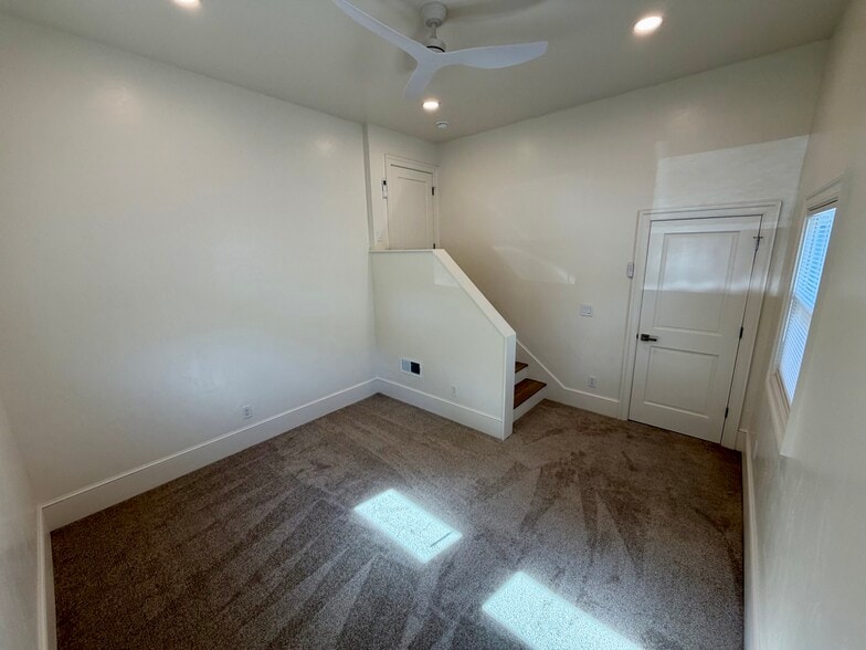 Bedroom #5. This is the converted garage. It could also be used for a den/playroom. - 329 Ronald Dr