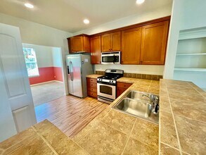 Building Photo - Cedar Hills/Mills Area Two Bedroom Townhome with 2 Car Garage, A/C & Private Deck.