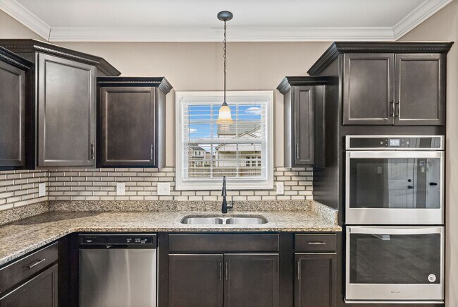 Building Photo - Four Bedroom with Three Car Garage!