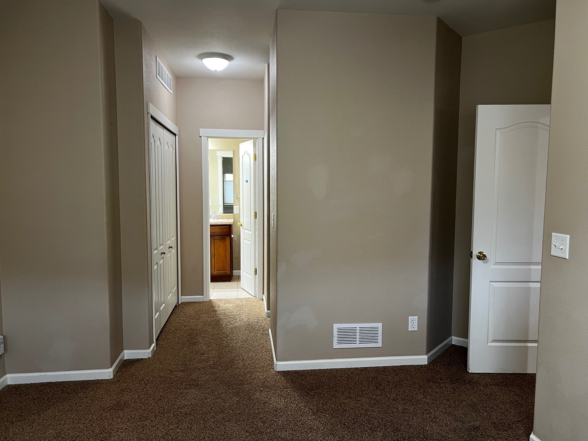 Master Bedroom Suite view towards closets and /Bathroom - 5021 Mountain Man Ln