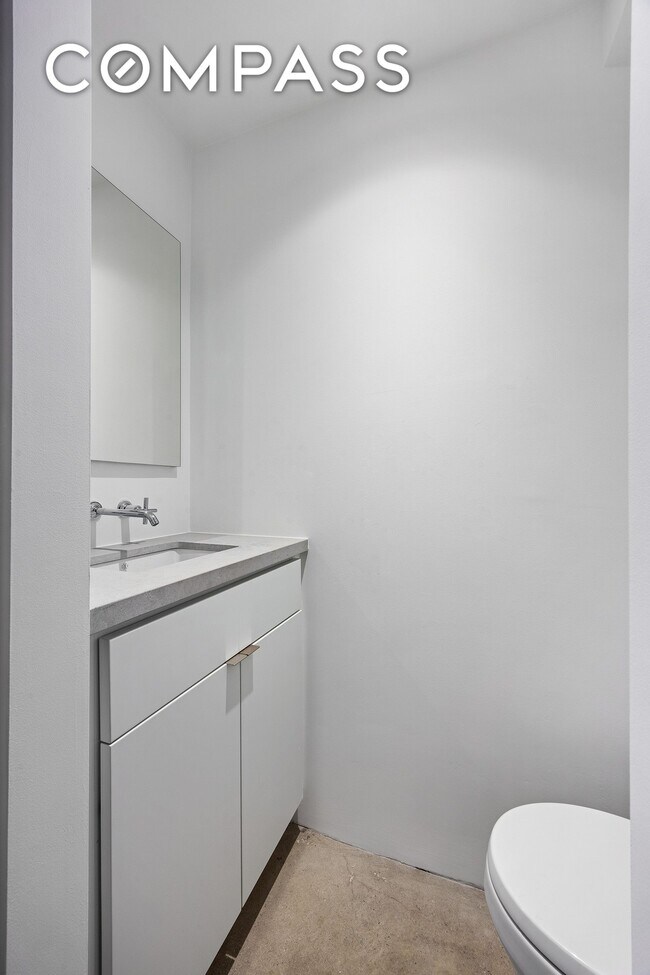 Building Photo - Loft-style one-bedroom with double-height ceilings, oversized windows, and private garden in the ...