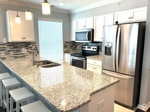 Building Photo - Remodeled 2 Bedroom, 2 Bath Furnished Cond...