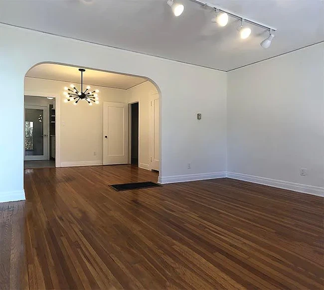 Interior showing partial living room, dining room with view to back - 1443 Centinela Ave