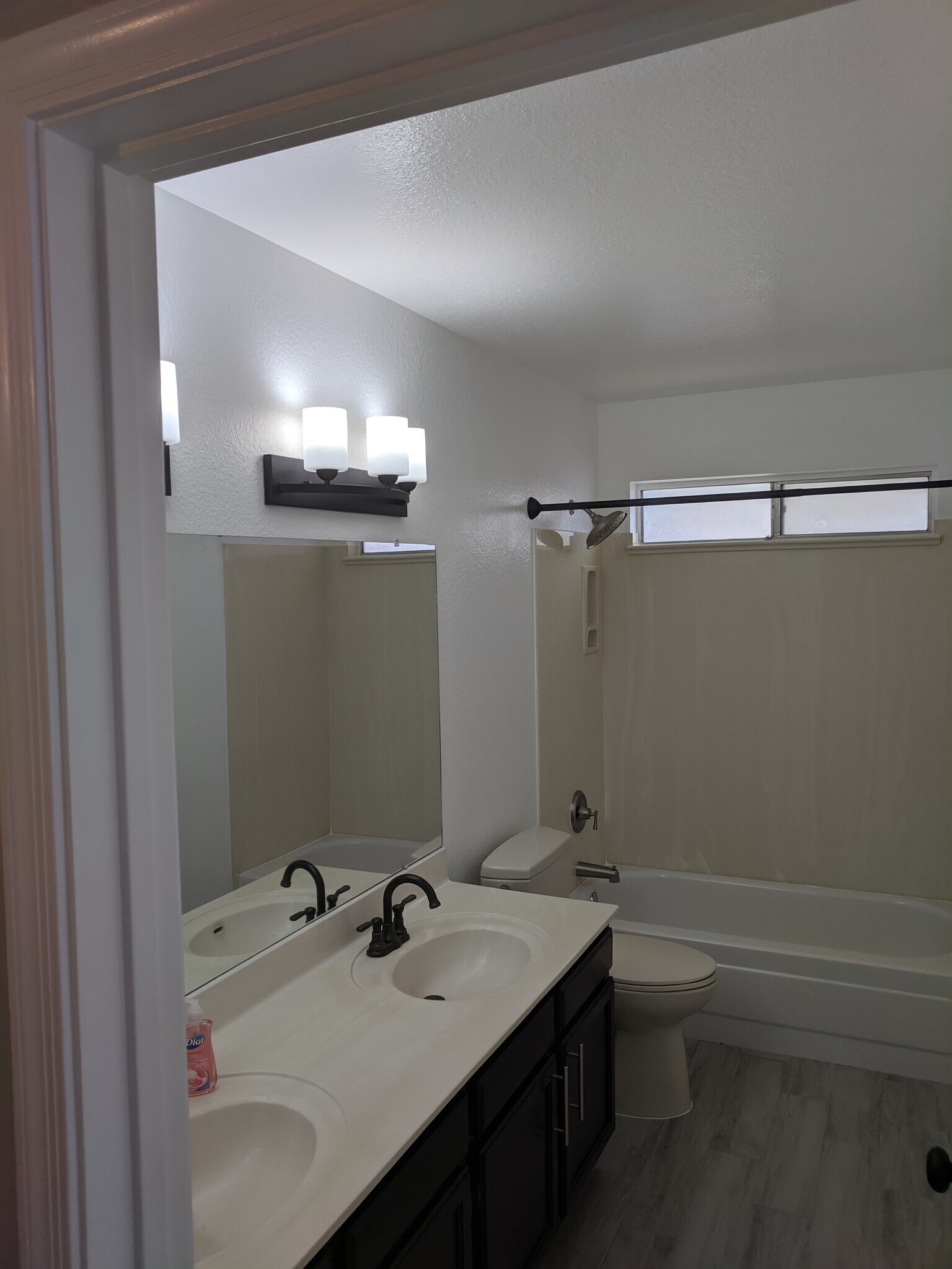 Hall Bath - Oil Rubbed Bronze light fixtures and faucets - 14101 N 78th Dr