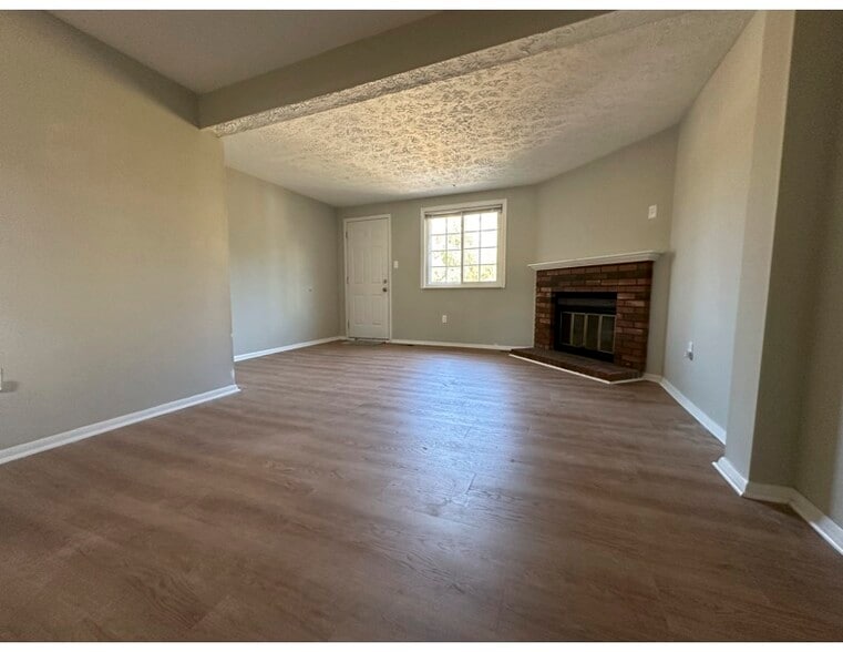 Living Room Corner Fireplace - 5811 Rowanberry Dr