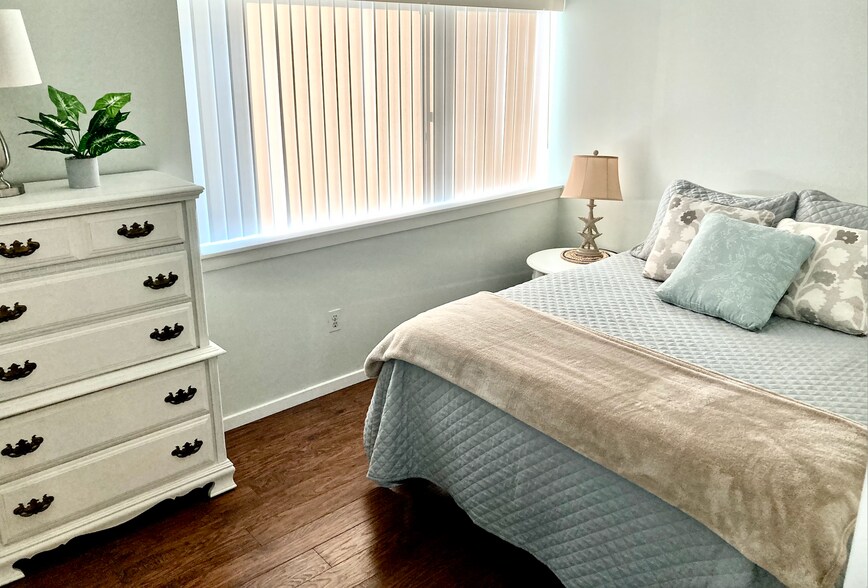 2nd bedroom with dresser and nightstand - 85 Viscount Dr