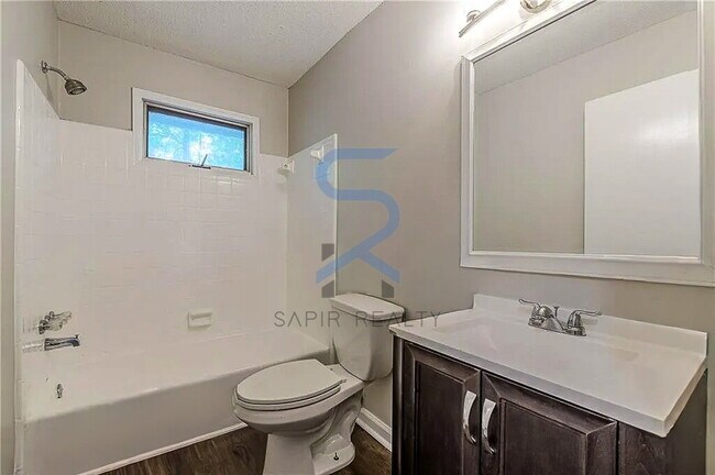 Building Photo - Move in before December 15th and choose your reward: a $250 Amazon Gift Card or a 55" Smart TV!