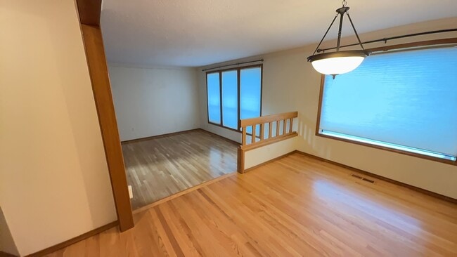 Building Photo - 4bd/3ba HUGE Home w/Hardwood Floors, Russian Fireplace, 2-Car Garage & Fenced Back Yard!