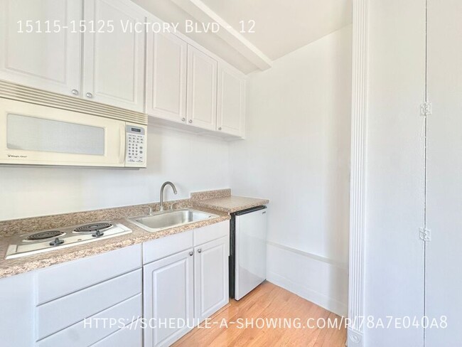 Building Photo - Updated top floor Studio apartment located...