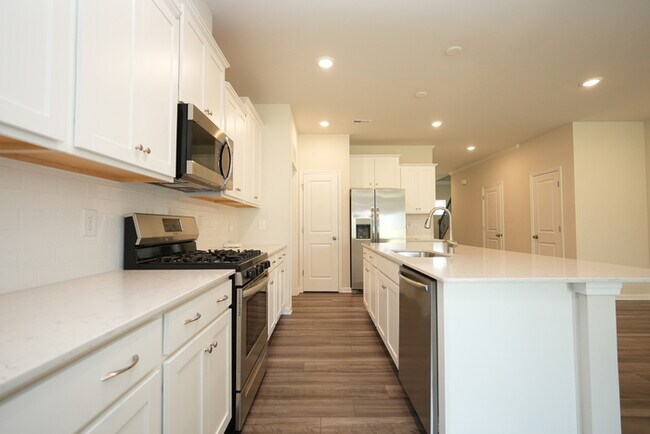 Building Photo - Spacious 4-Bedroom Home with Modern Comforts