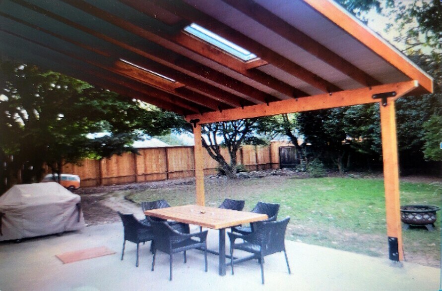 Large fenced in backyard with covered patio and dog door to the kitchen - 5252 NE 49th Ave