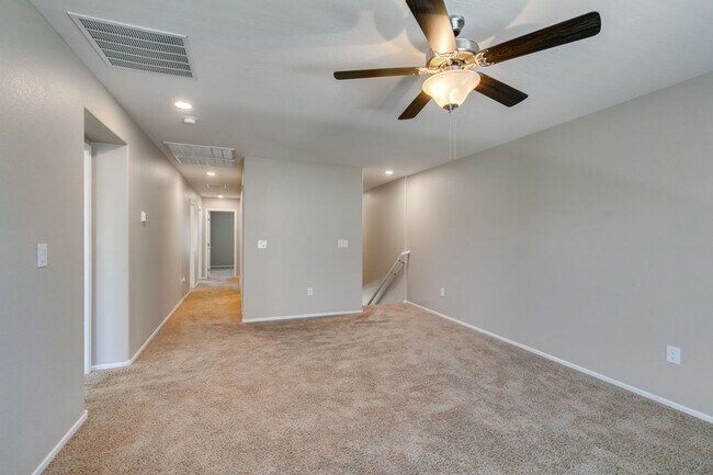 Building Photo - Spacious Townhouse with Loft & Rare 3-Car Garage!